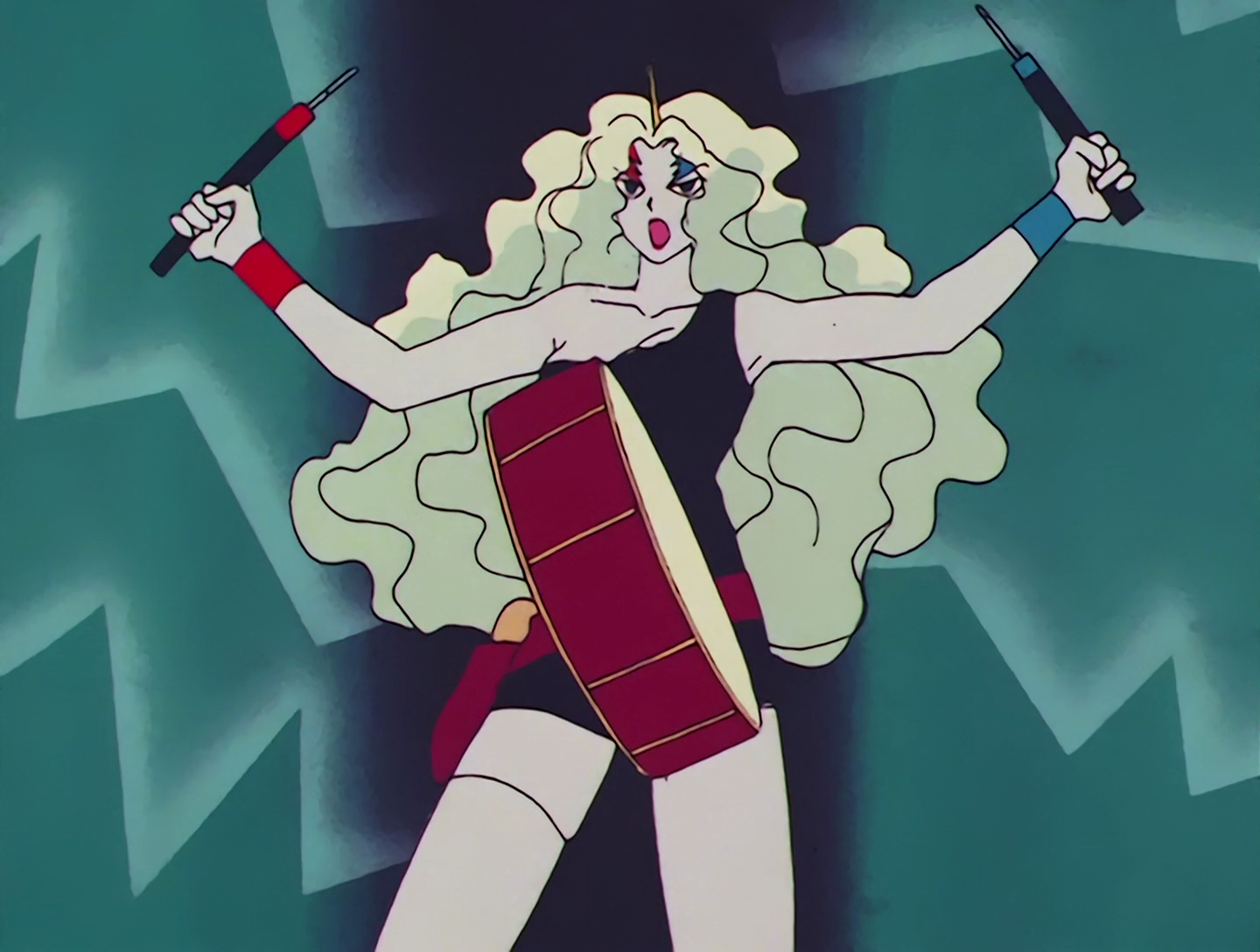 Furaiki, a Droid from Sailor Moon episode 64. She has light gray skin and long hair that’s very pale green, almost white. She has a thin horn coming up from the top of her head, and red and blue lightning bolts painted over each eye. Her outfit is black, and she has red and blue bracelets, while wielding red and blue drumsticks. She has a large drum positioned in front of her.